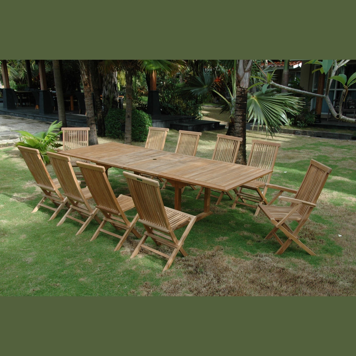 Wooden outdoor dining table with chairs on a grassy area