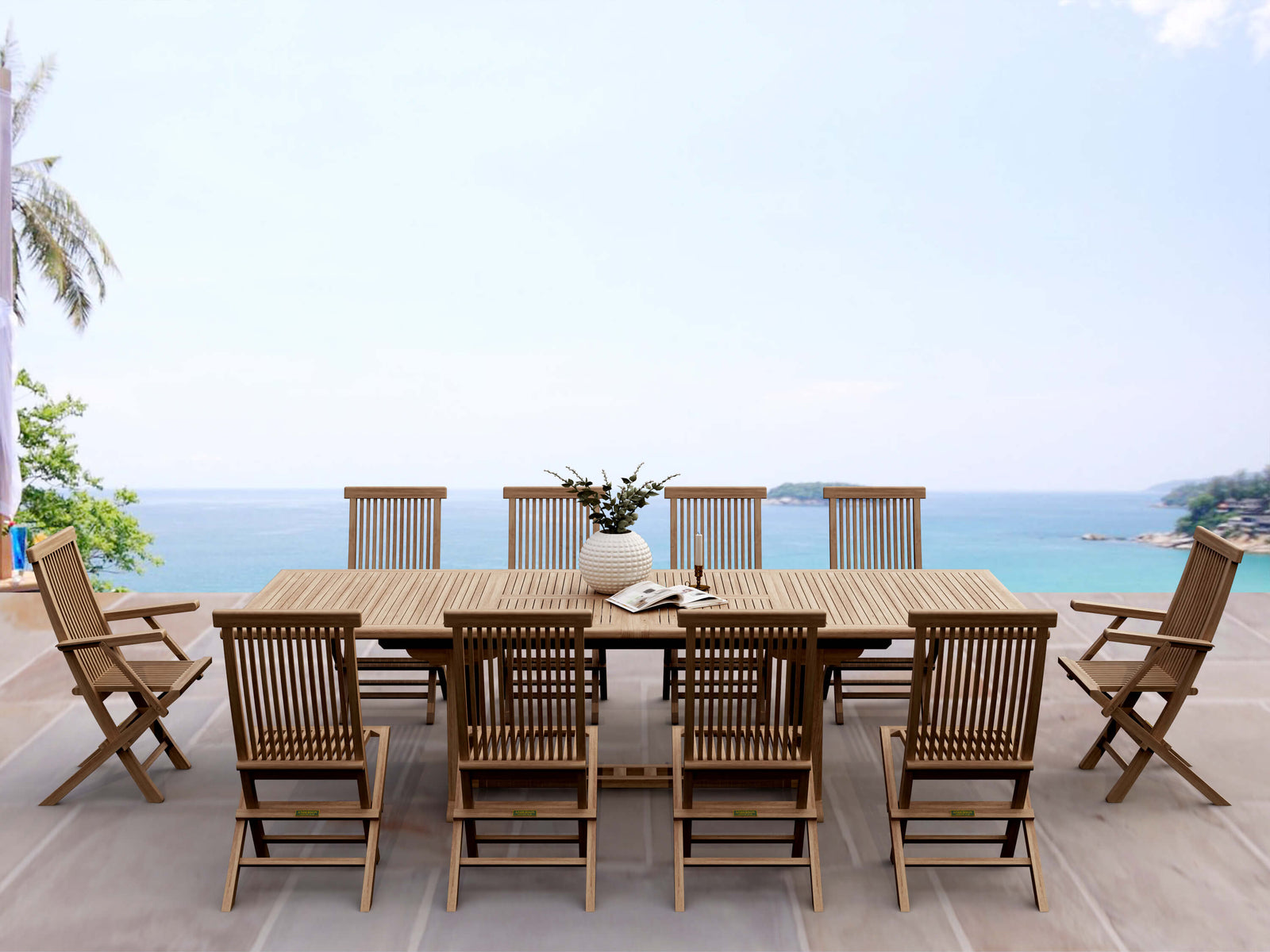 Wooden outdoor dining set with chairs on a deck overlooking the ocean.