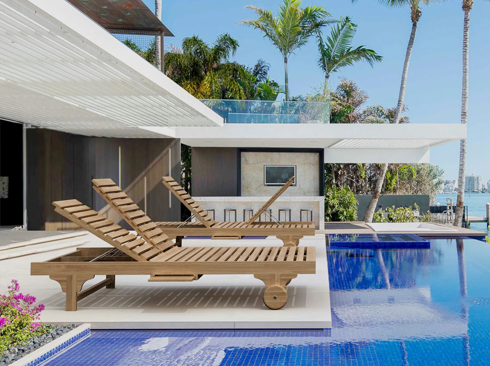 Wooden lounge chairs by a pool with palm trees and a clear sky