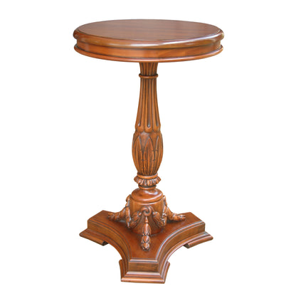 Wooden pedestal table with decorative base on a white background
