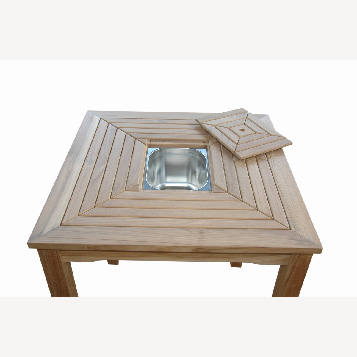 Wooden table with a metal bowl in the center on a white background
