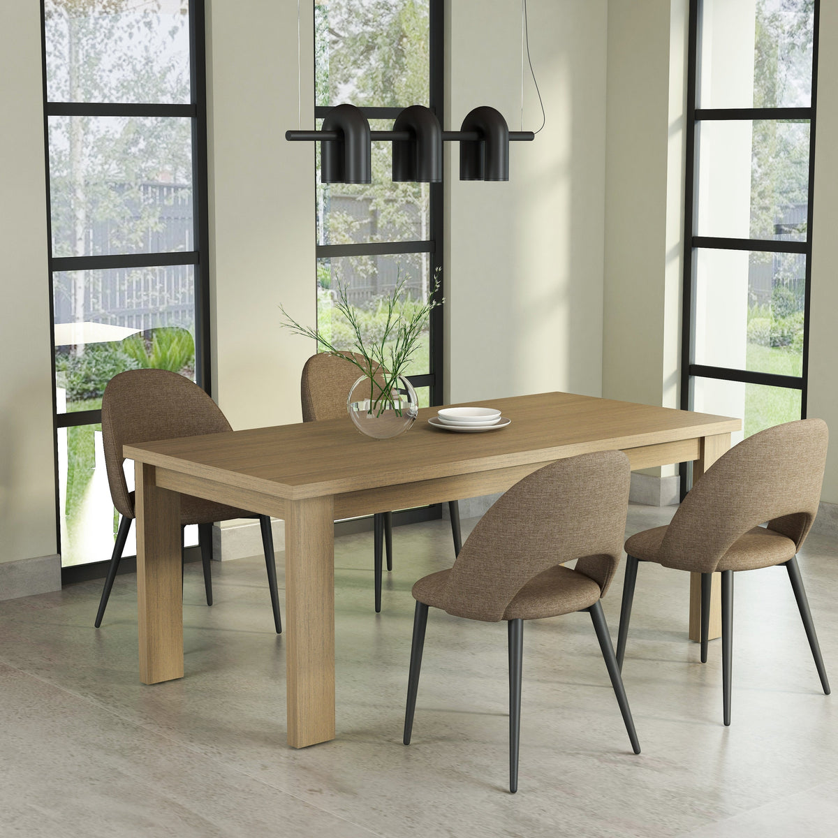 Dining room with a wooden table and chairs near large windows.