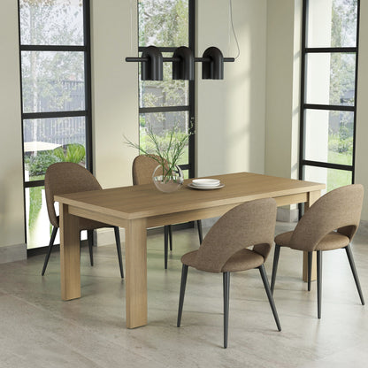 Dining room with a wooden table and chairs near large windows.