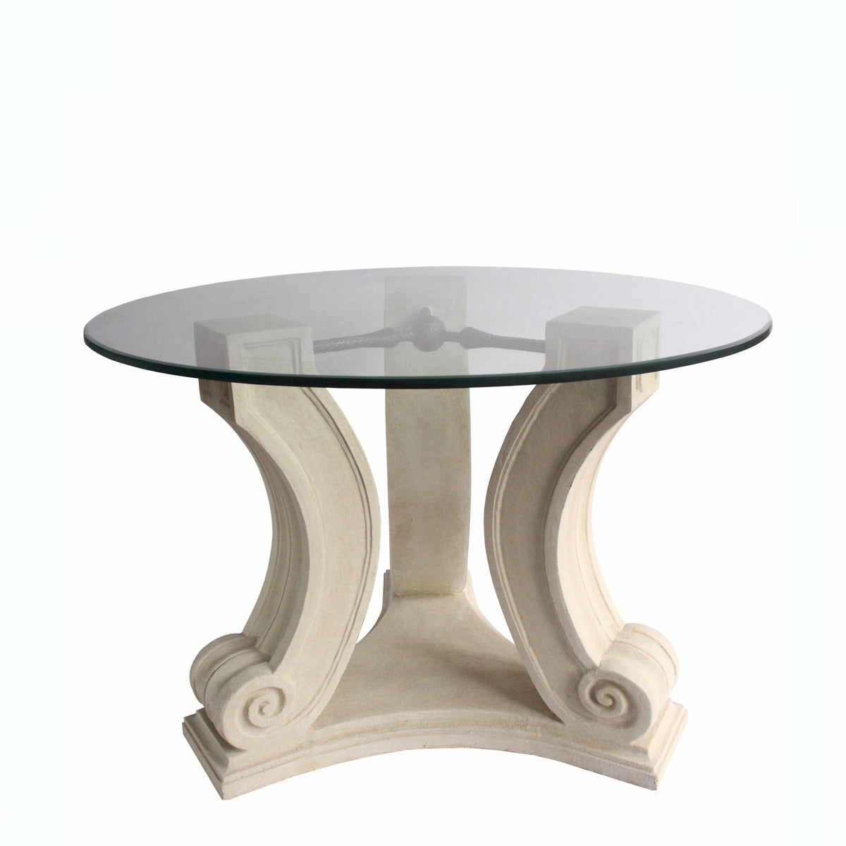 Round glass table with decorative white base on a white background
