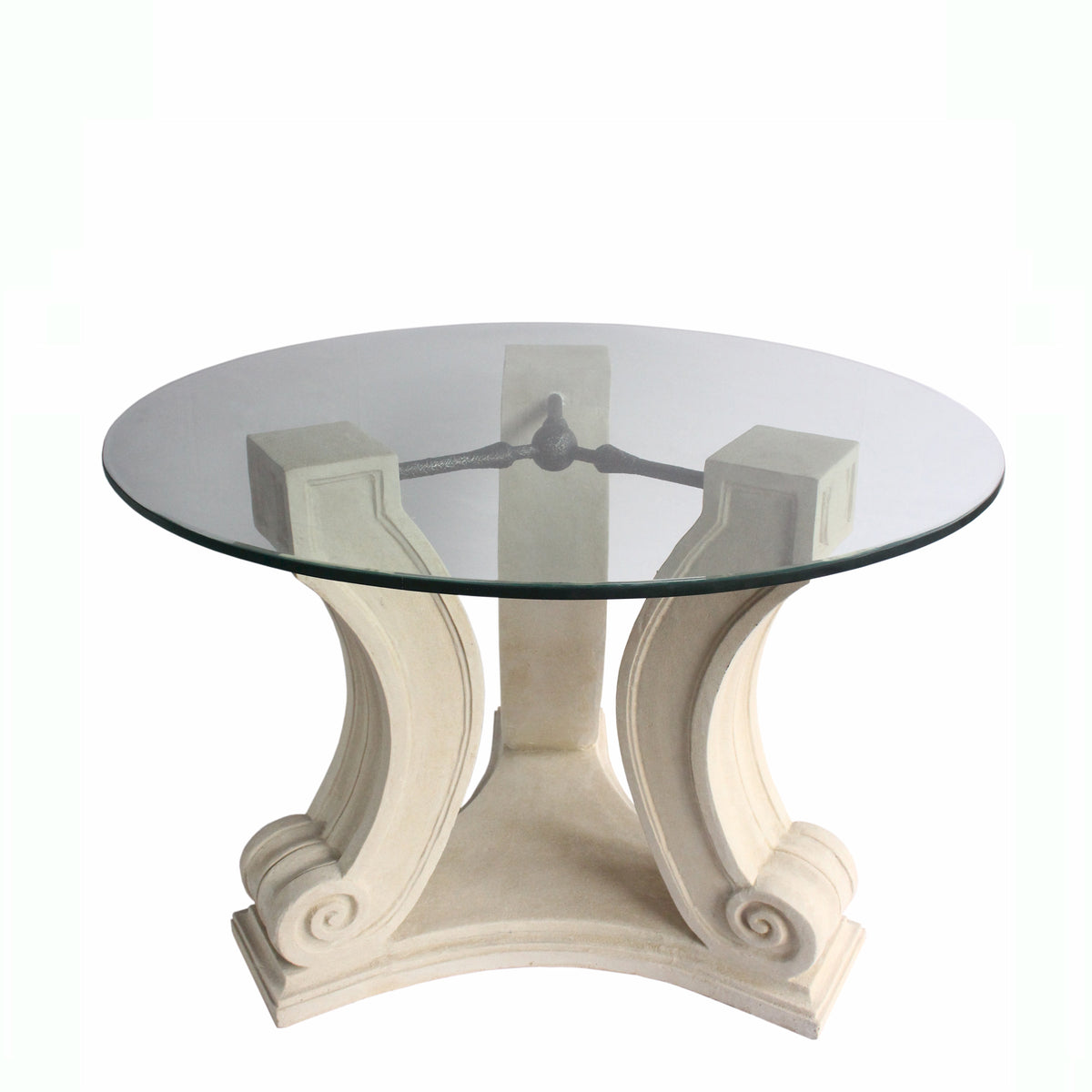 Round glass table with decorative white base on a white background