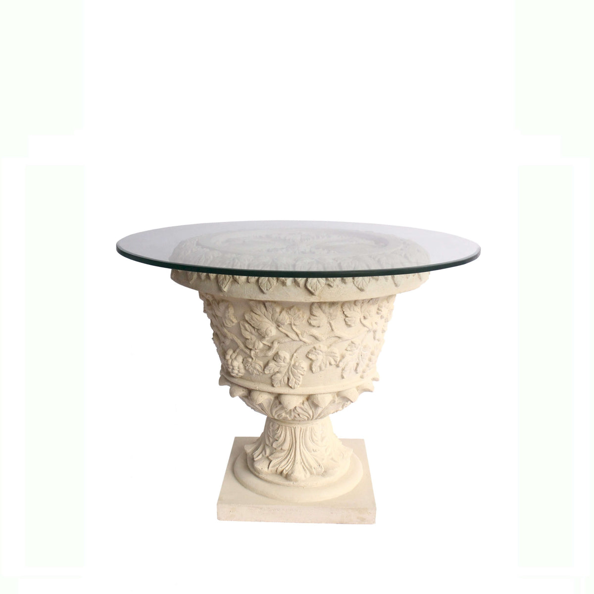 Decorative table with classical design and glass top on a white background