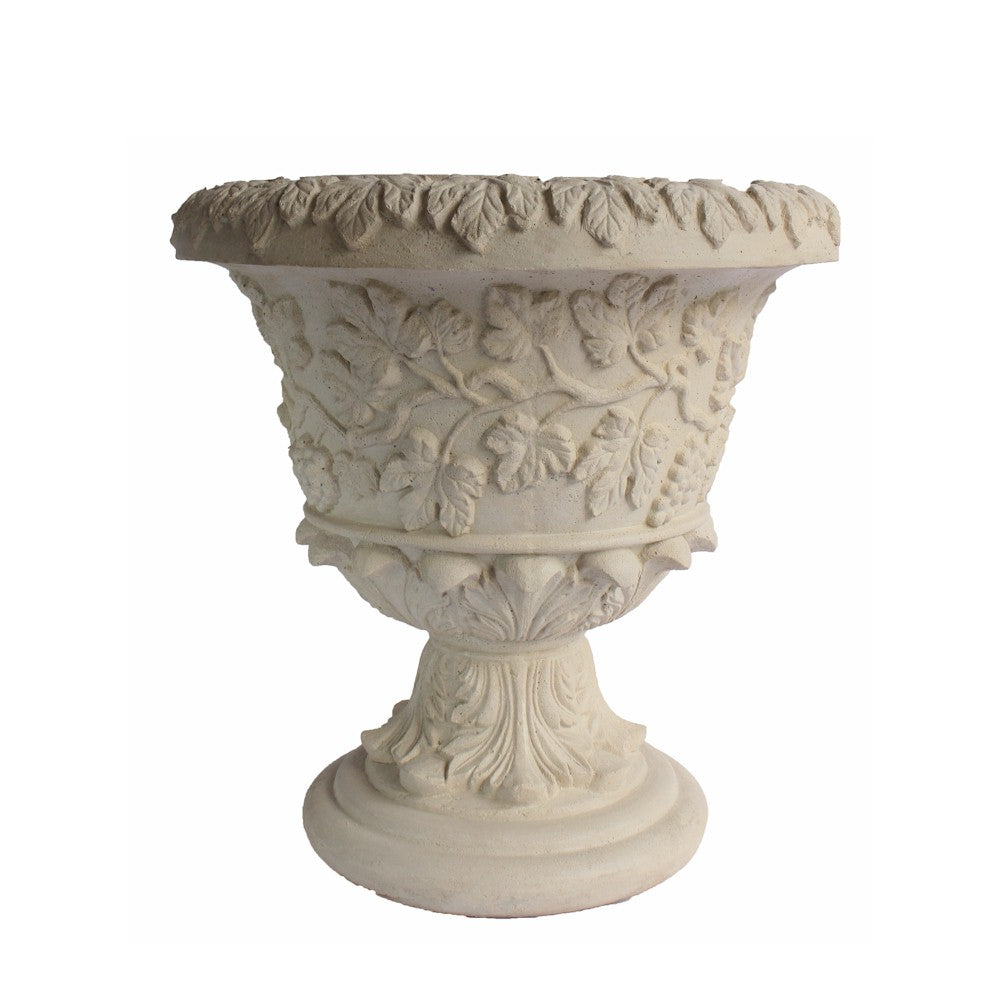 Decorative stone urn with intricate carvings on a white background