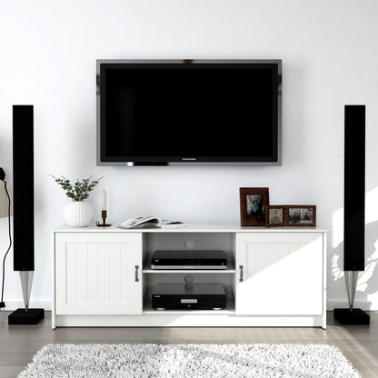 Modern living room setup with a TV mounted on the wall, white entertainment console, and speakers.
