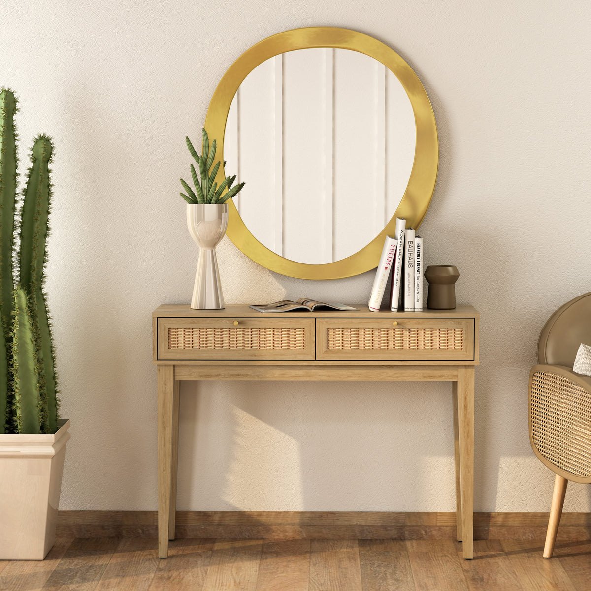 Wooden console table with round gold mirror, books, and plants in a room.