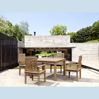 Outdoor wooden dining set with chairs on a patio area.