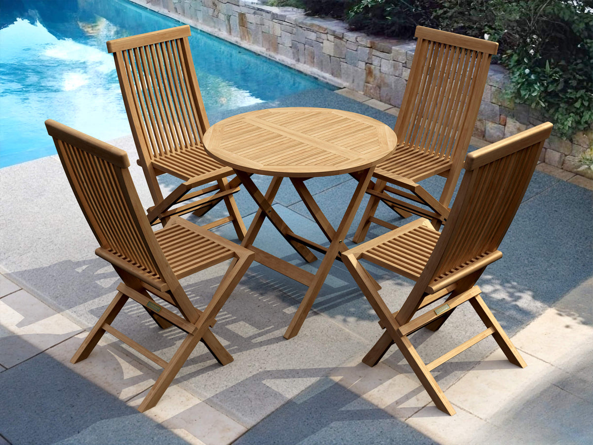 Wooden outdoor table with four matching chairs by a poolside.