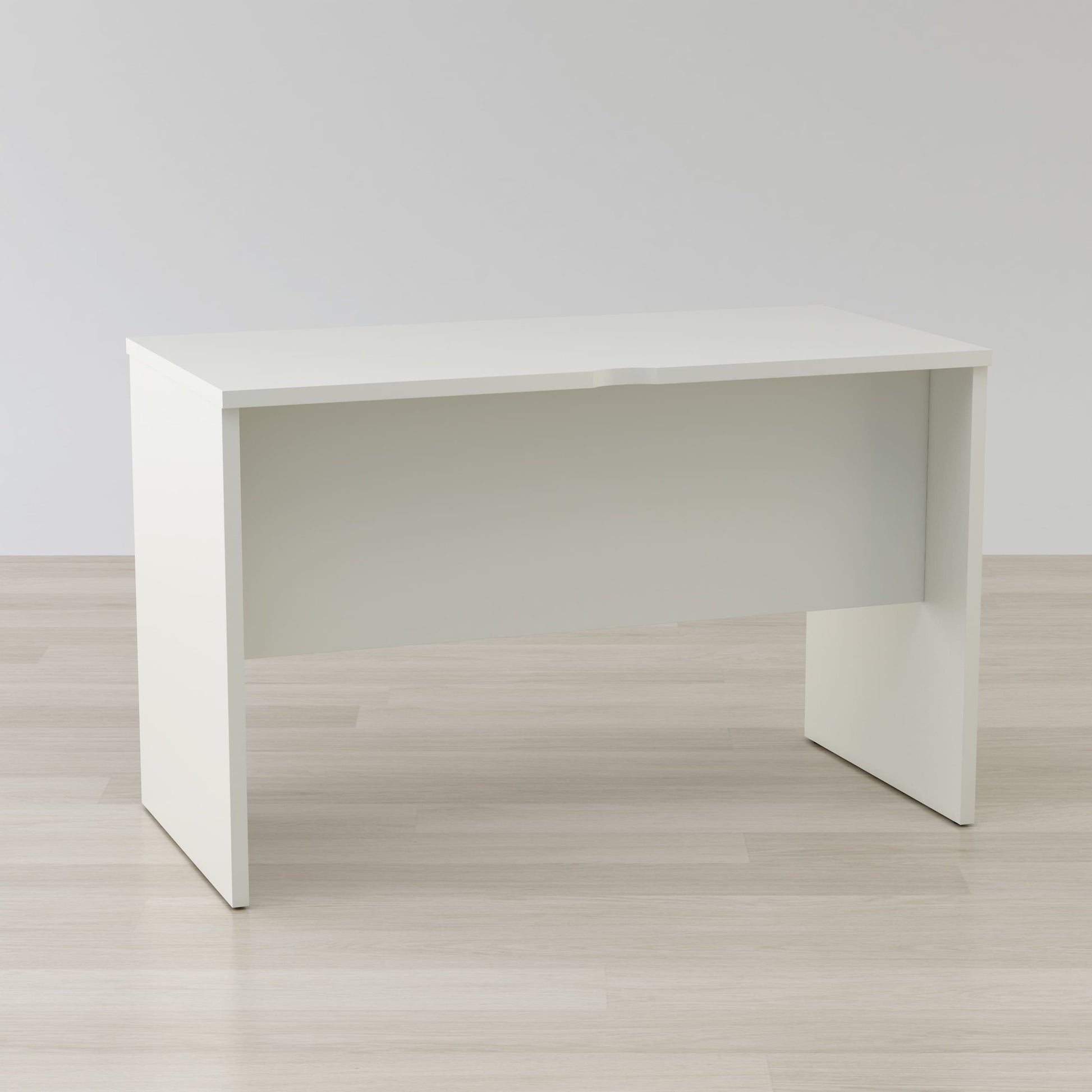 White desk on a light wooden floor with a plain white wall background