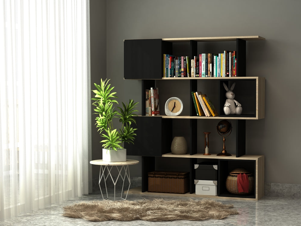 Modern bookshelf with decorative items against a gray wall