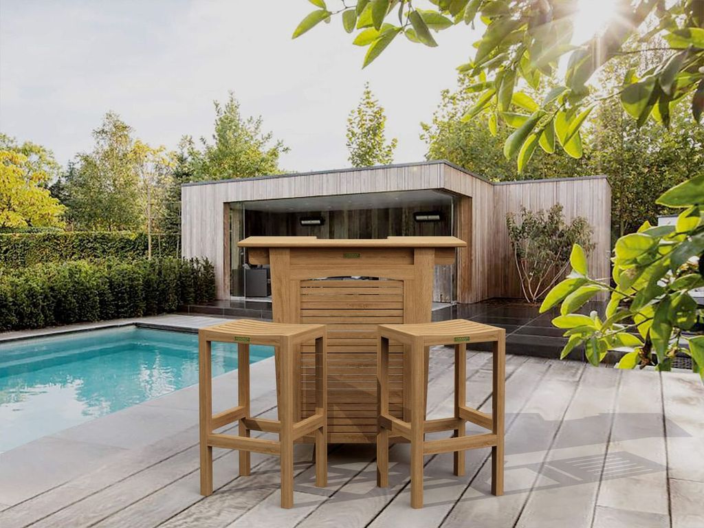 Wooden outdoor bar set with stools by a poolside