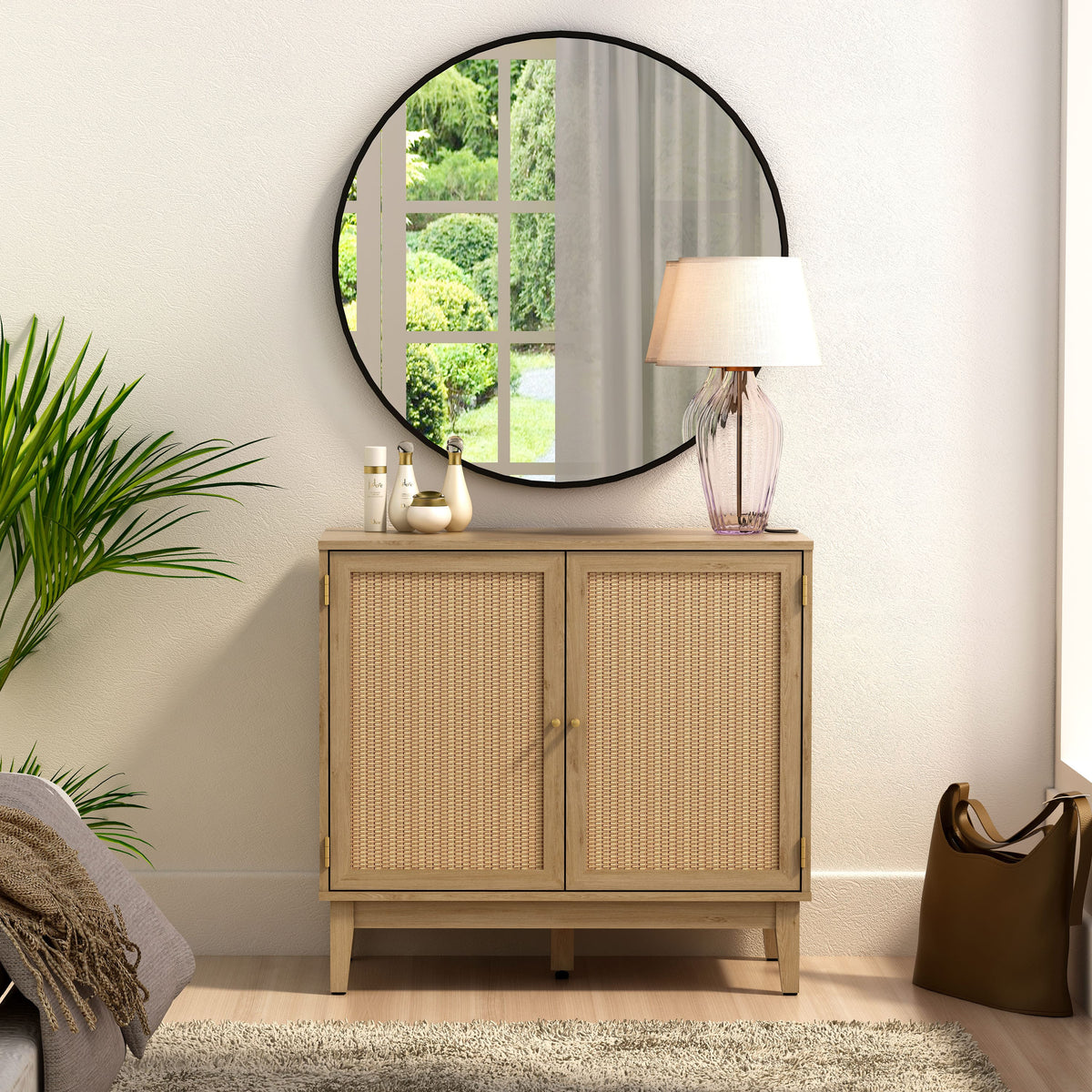 Wicker cabinet with round mirror and lamp in a room setting