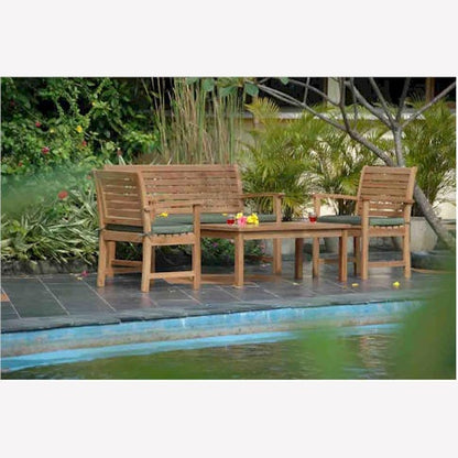 Wooden outdoor furniture set by a pool with greenery in the background