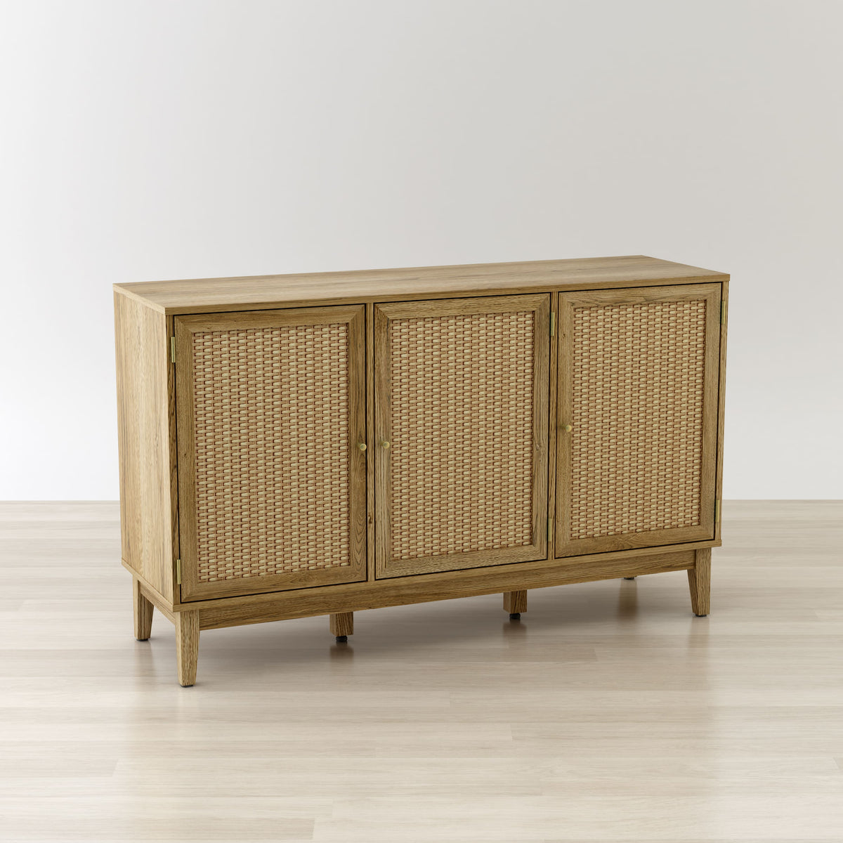 Wooden sideboard with wicker doors on a light wooden floor and white background