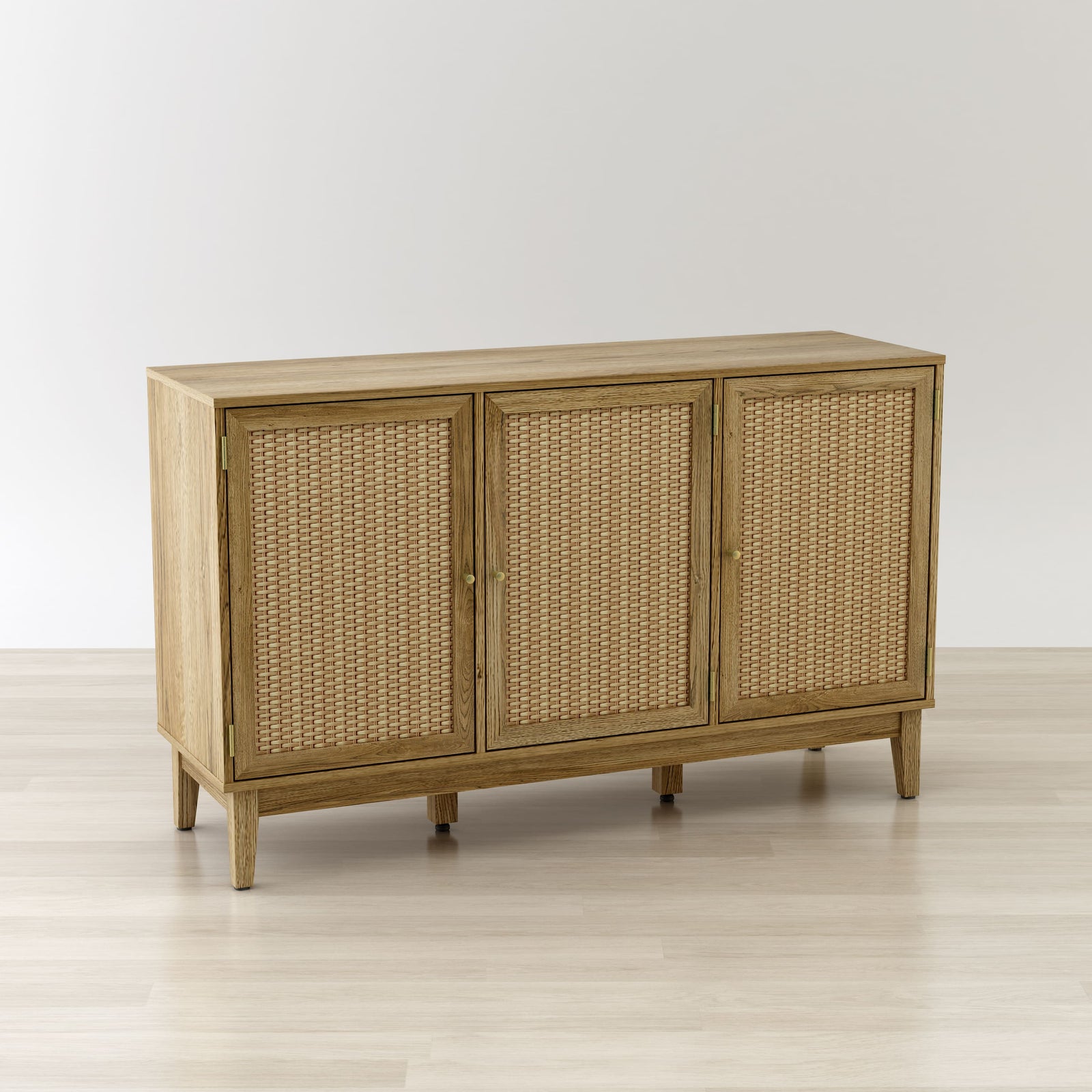 Wooden sideboard with wicker doors on a light wooden floor and white background
