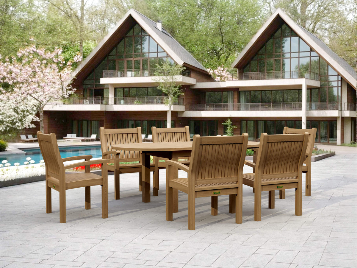 Wooden outdoor dining set in front of a modern house with a pool.