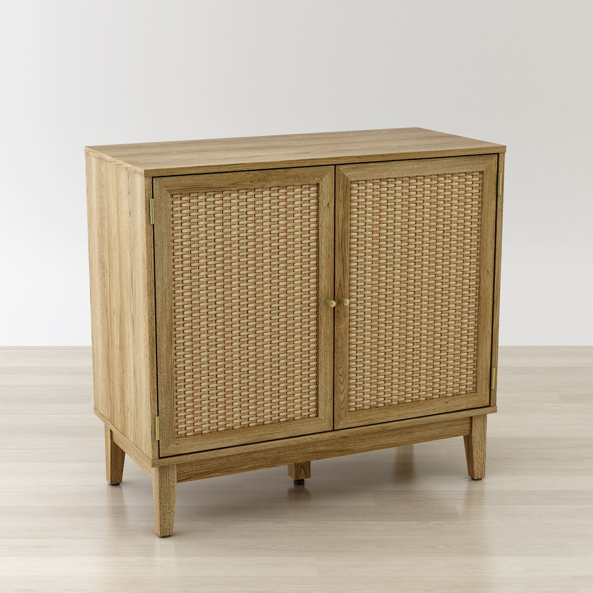 Wooden cabinet with wicker doors on a light wooden floor and white background