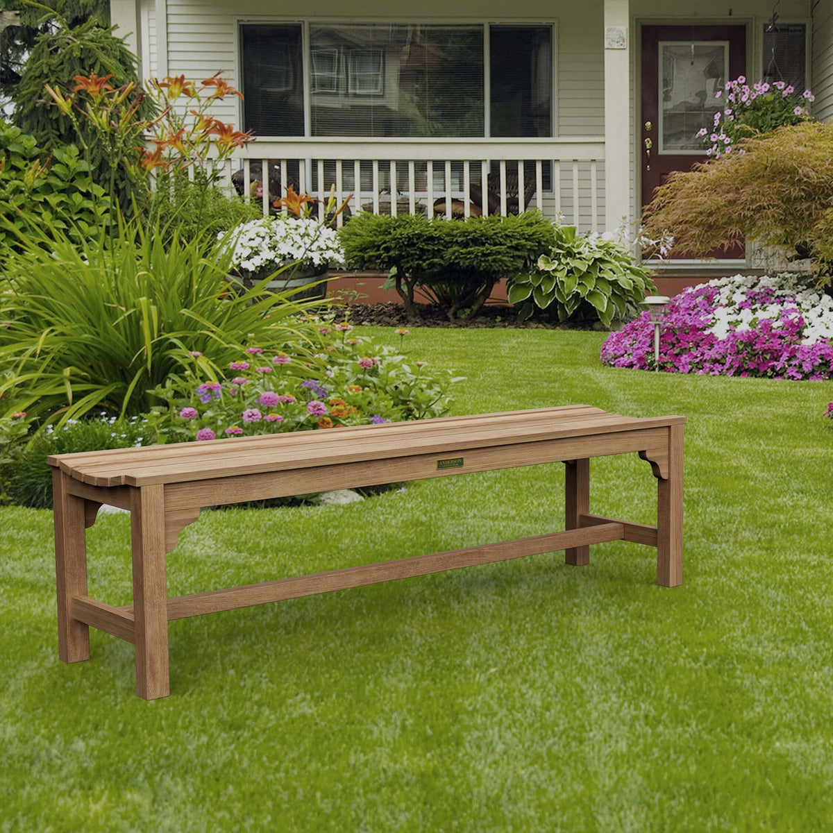 Wooden bench on a well-maintained lawn with a house in the background