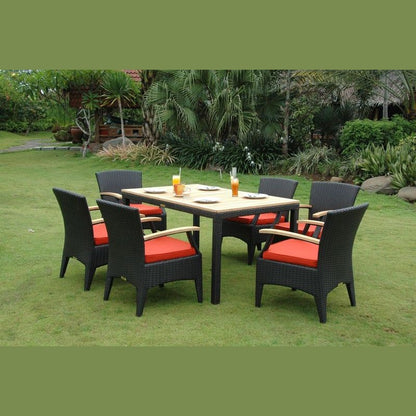 Outdoor furniture set with a table and chairs on grass