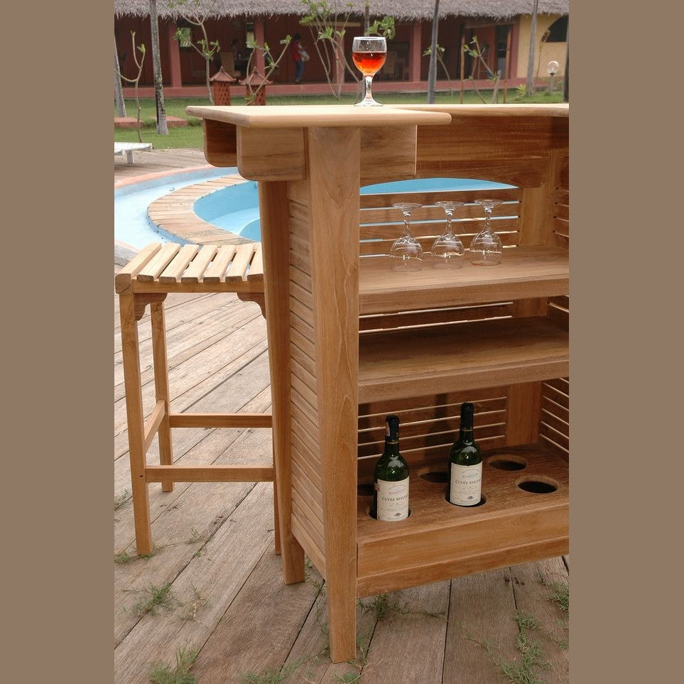 Wooden outdoor bar with wine bottles and glasses near a pool
