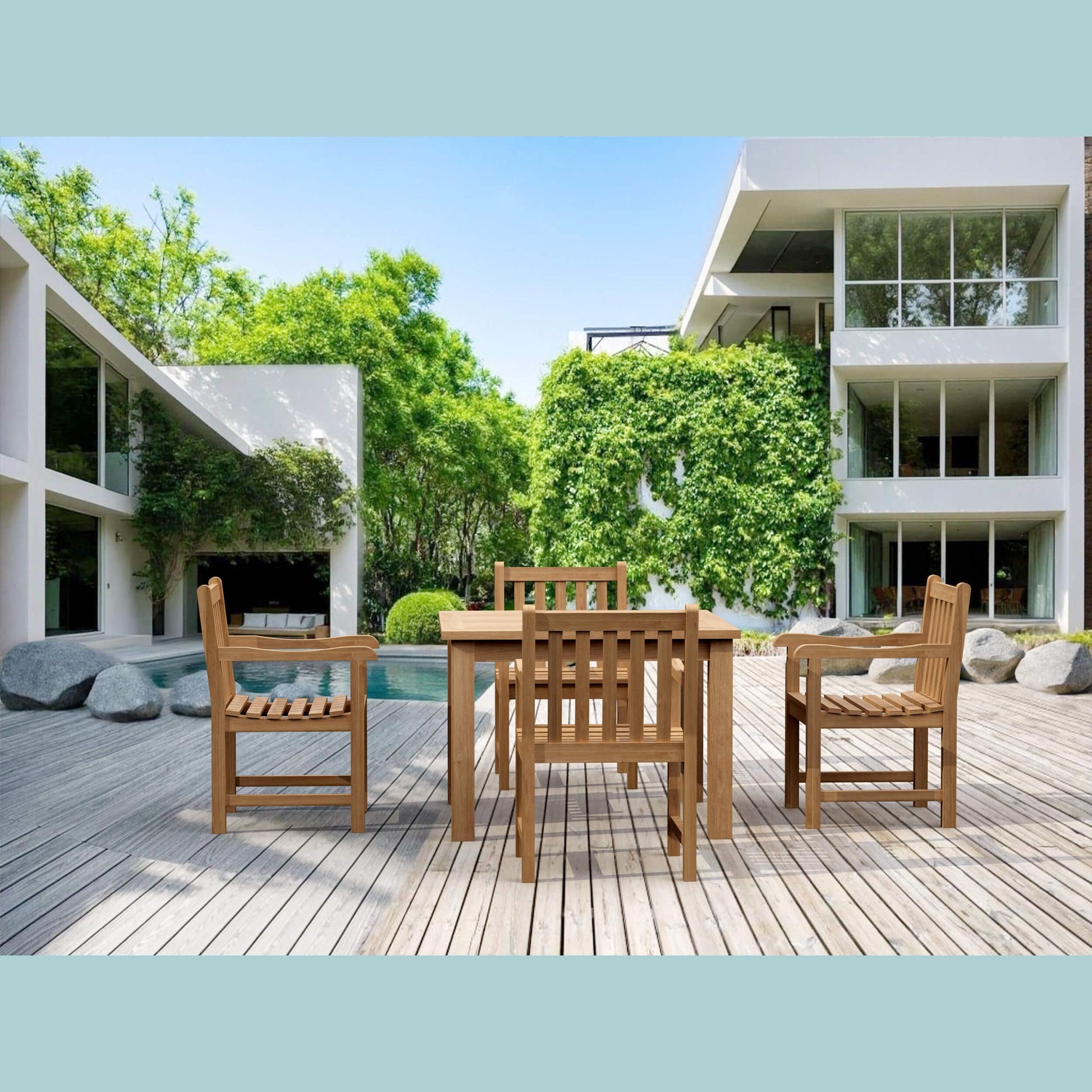 Wooden outdoor dining set on a deck with modern building and pool in the background