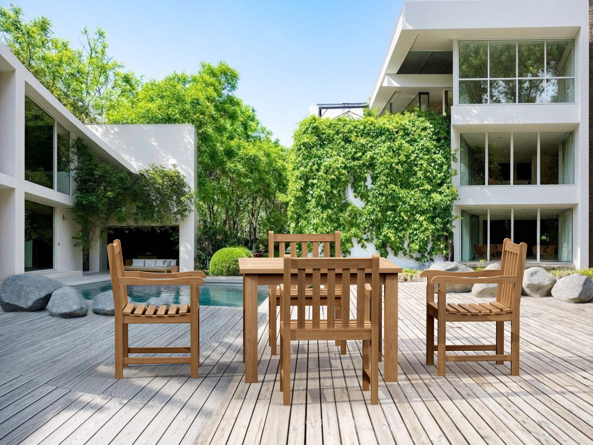 Wooden outdoor dining set on a deck with modern building and pool in the background