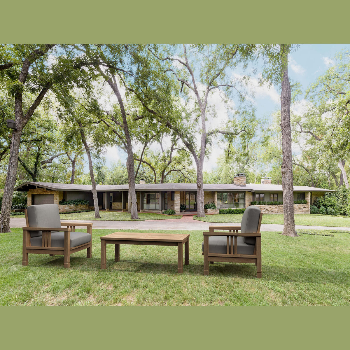 Outdoor furniture set on a grassy area with trees in the background