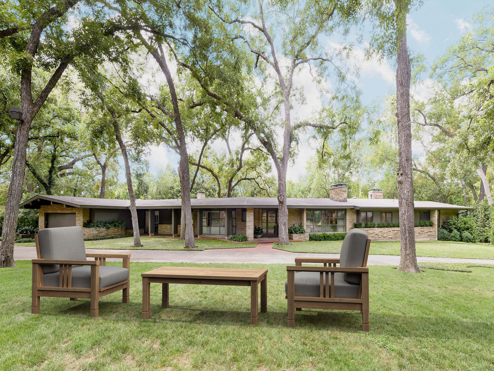 Outdoor furniture set on a grassy area with trees in the background