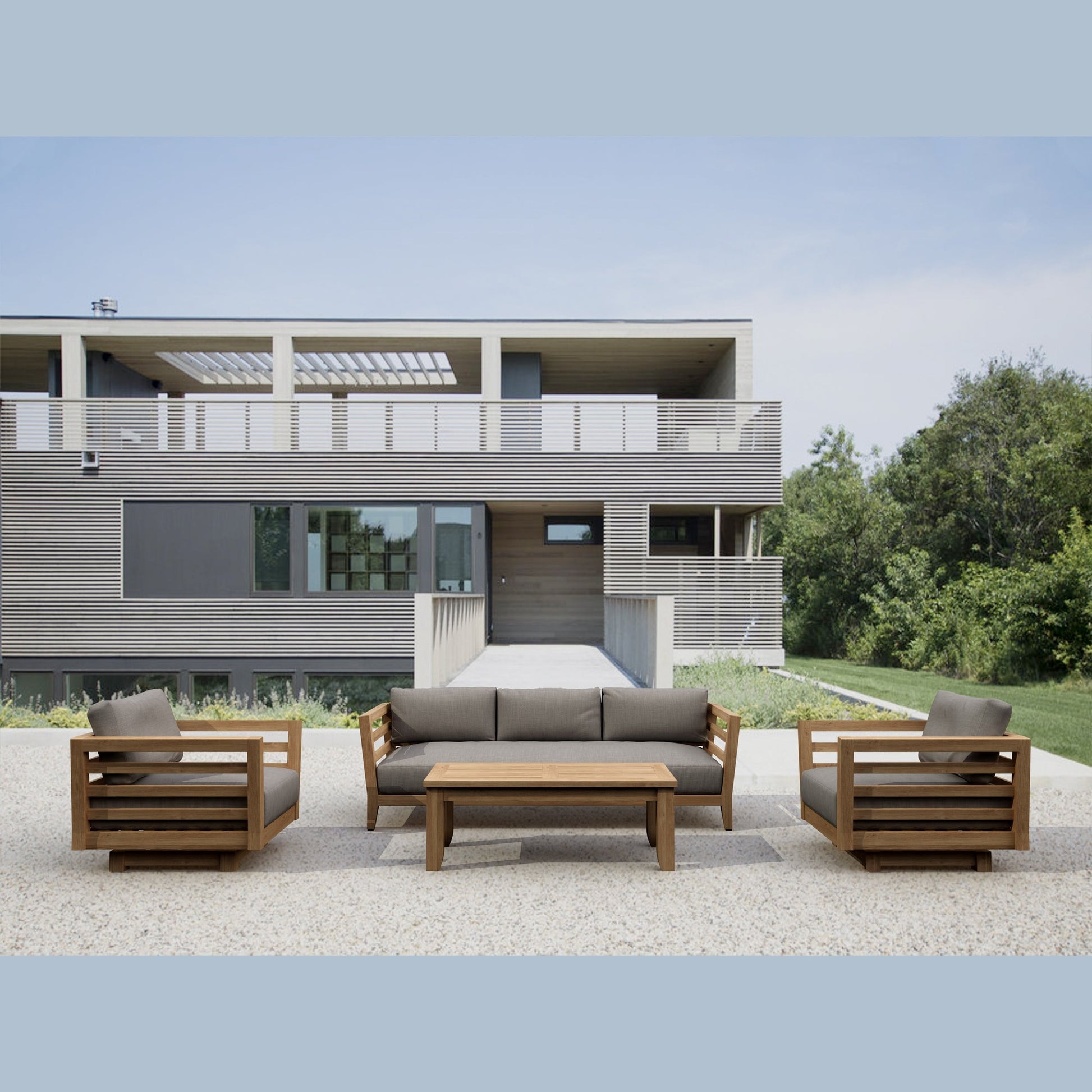 Modern outdoor furniture set in front of a contemporary house