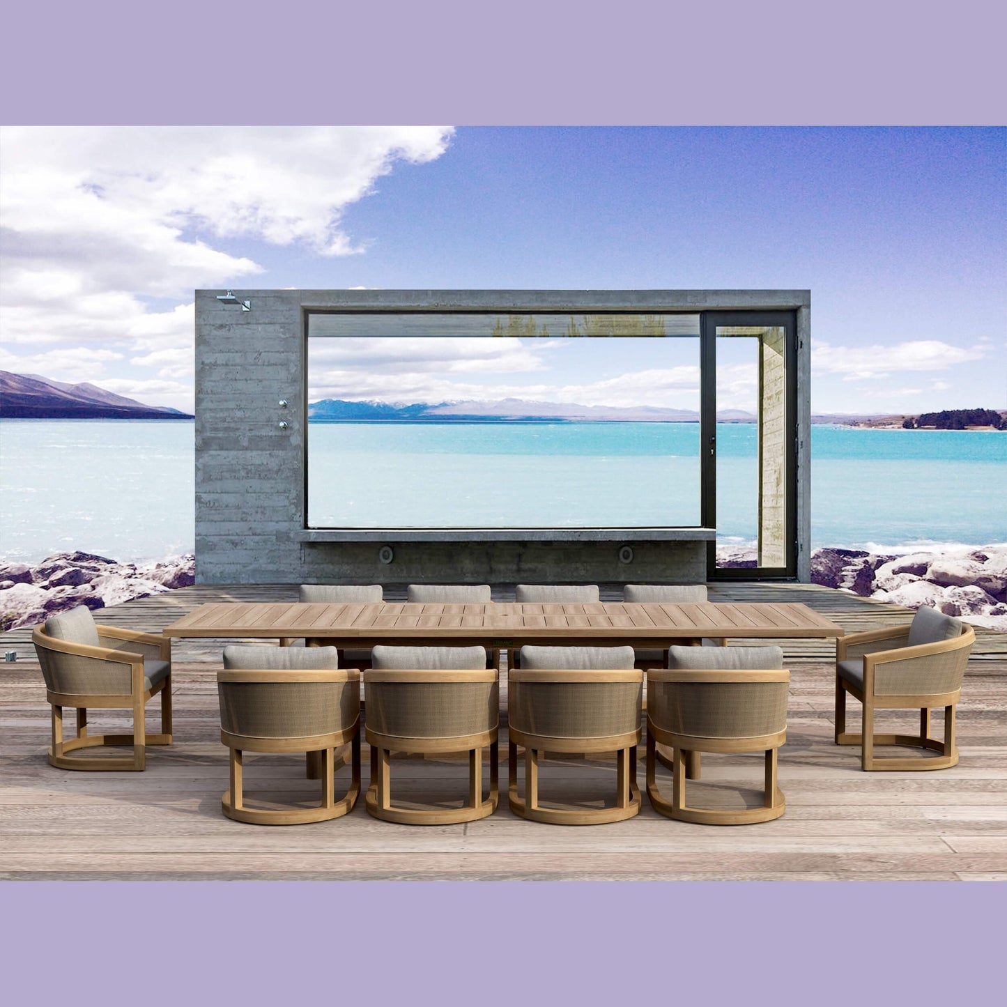 Outdoor dining area with a large flat-screen TV mounted on a wall overlooking a scenic lake.