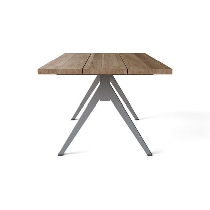 Wooden table with metal legs on a white background