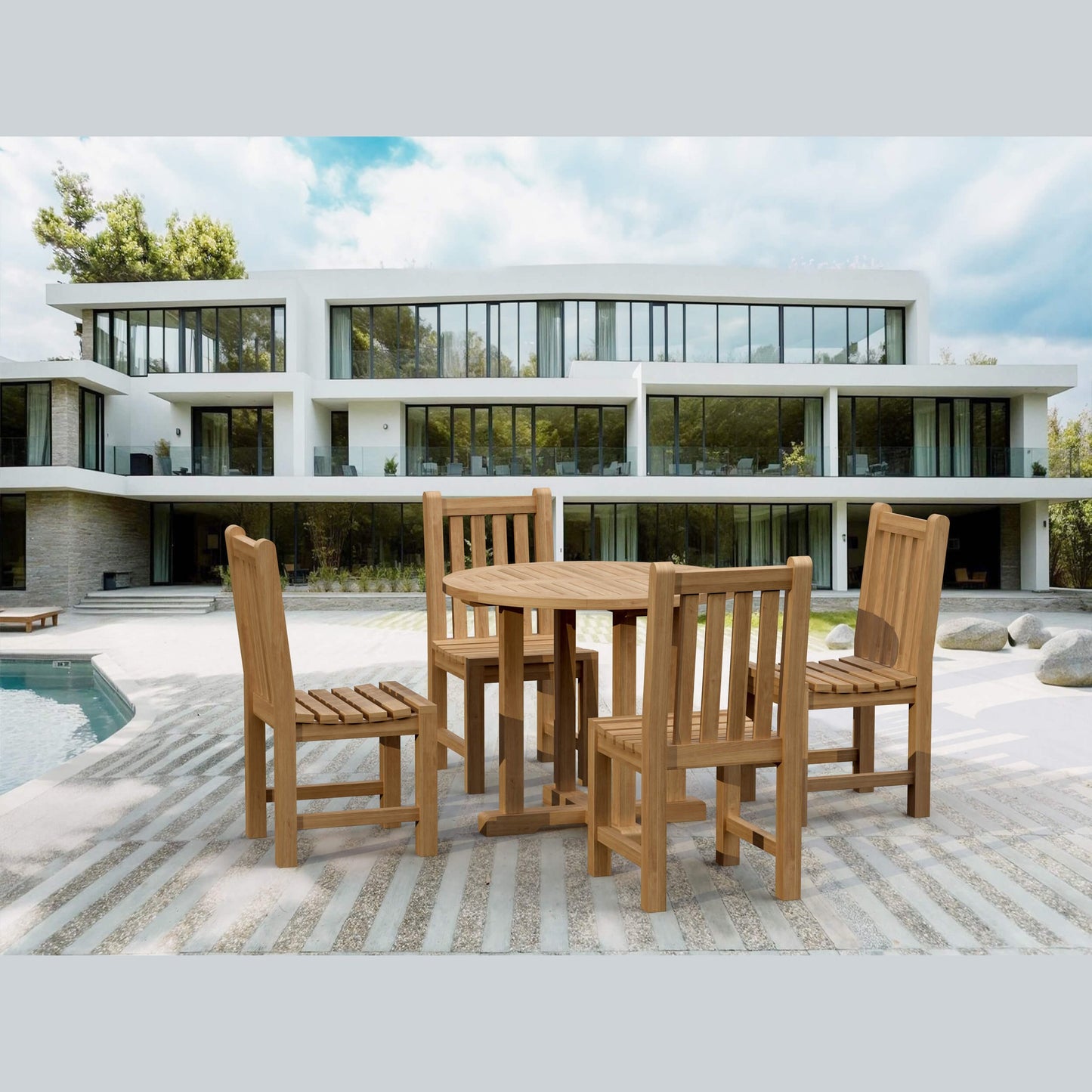 Wooden outdoor dining set with chairs on a patio in front of a modern building.