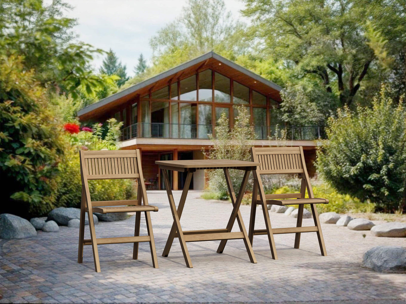 Wooden outdoor table and chairs in front of a modern house with a green, tree-filled landscape.