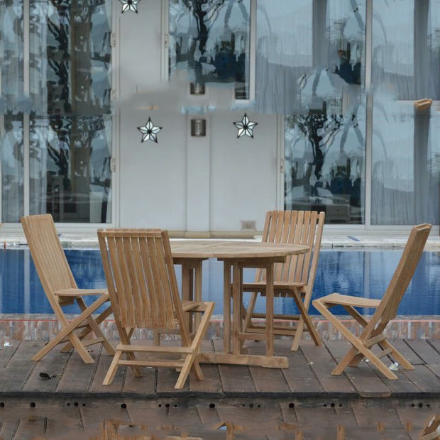 Wooden outdoor furniture set with table and chairs by a poolside.