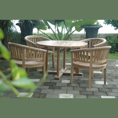 Wooden outdoor furniture set with round table and chairs on a paved patio.