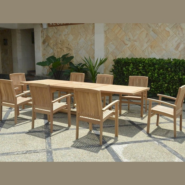 Wooden outdoor dining set with table and chairs on a stone patio.