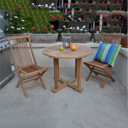Wooden outdoor table with two chairs and a colorful pillow on a patio.