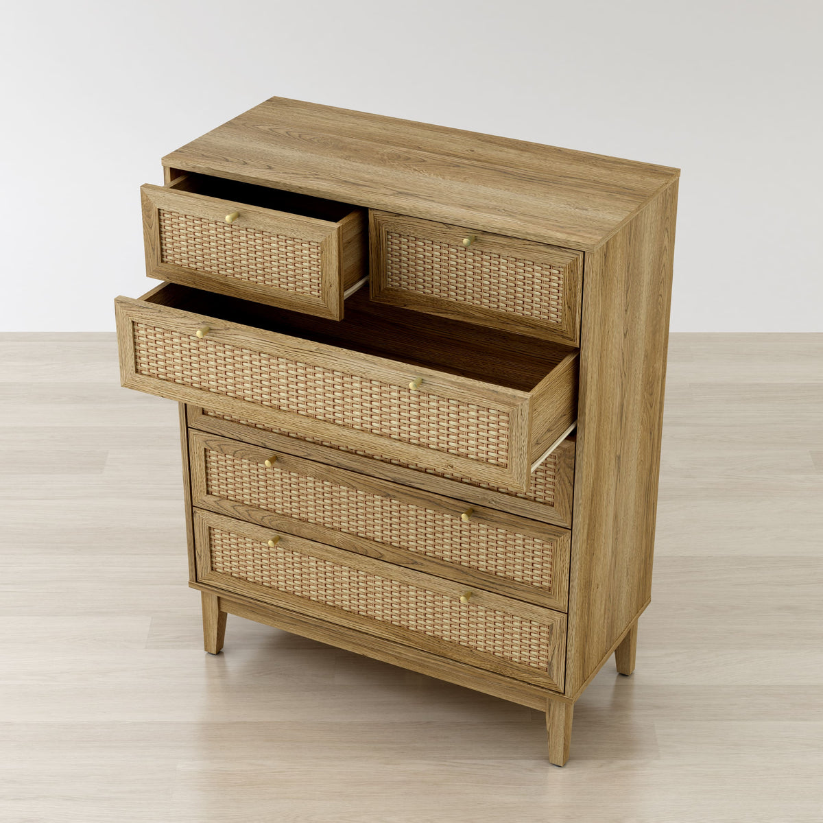 Wooden dresser with wicker drawers on a light wooden floor.