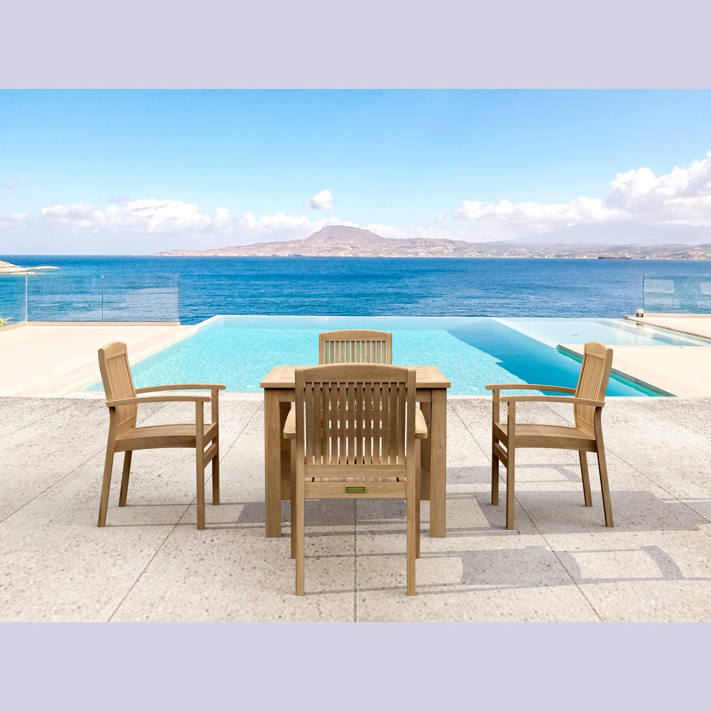 Wooden outdoor furniture set with table and chairs by a pool and ocean view