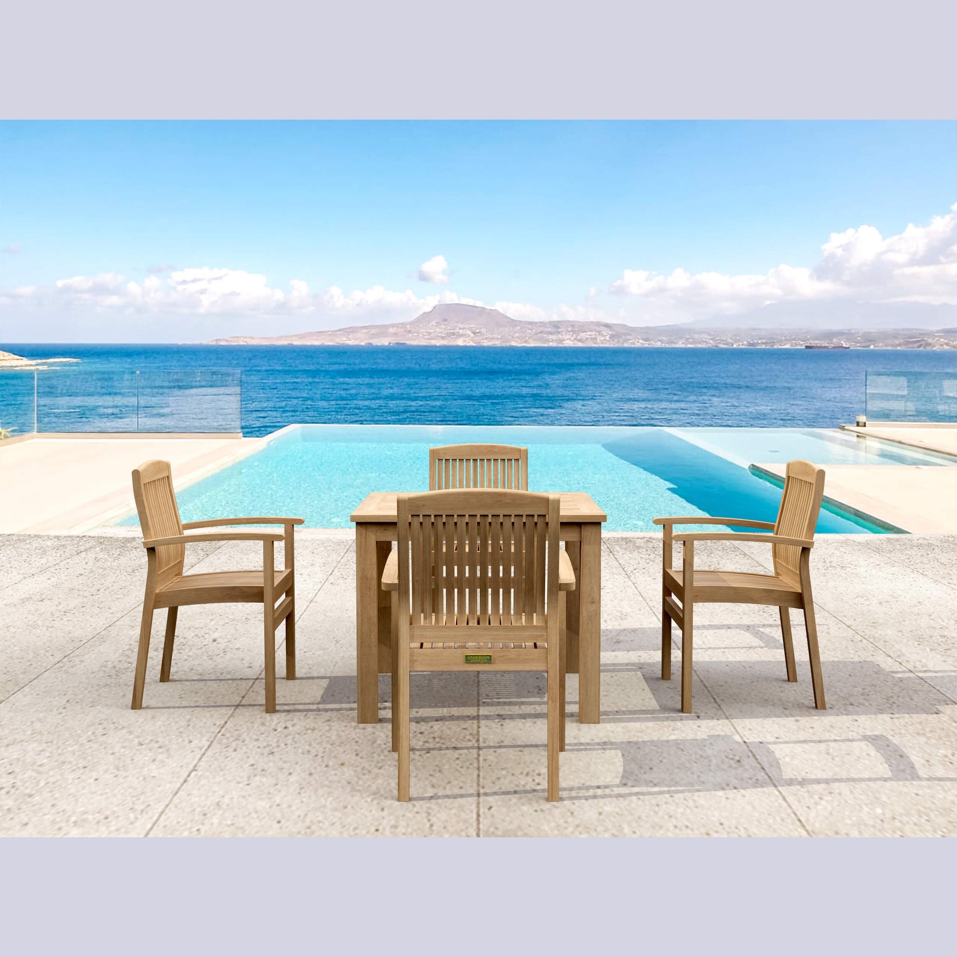 Wooden outdoor furniture set with table and chairs by a pool and ocean view