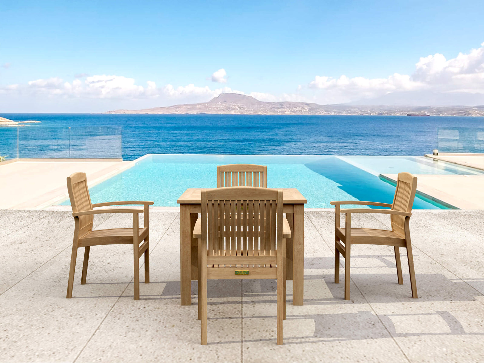 Wooden outdoor furniture set with table and chairs by a pool and ocean view