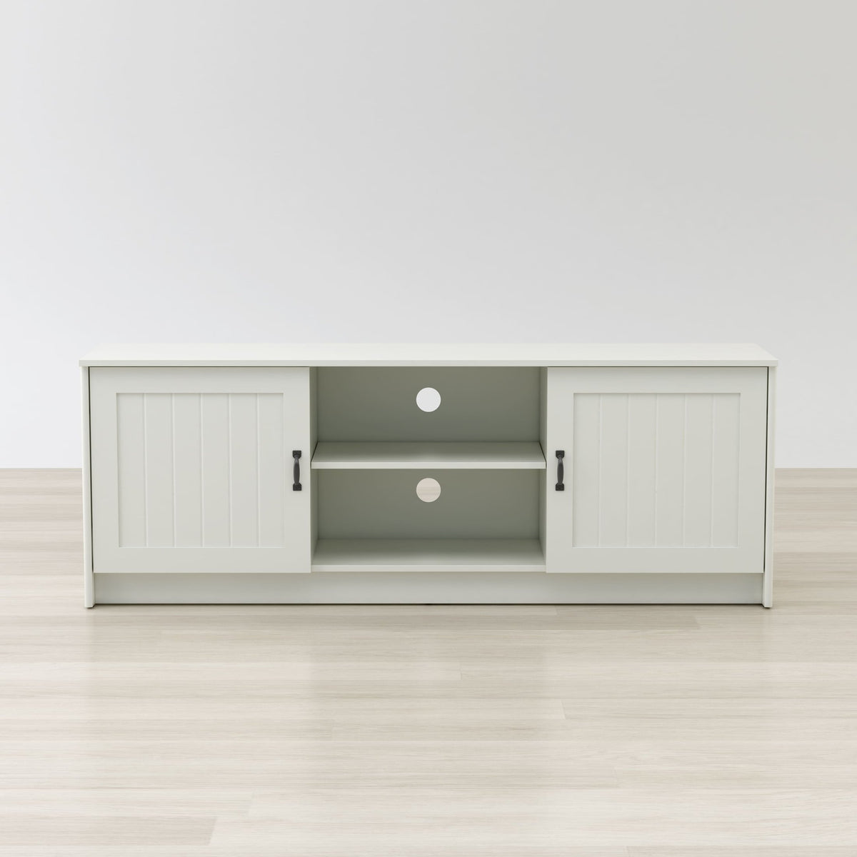 White entertainment console with open doors on a white background