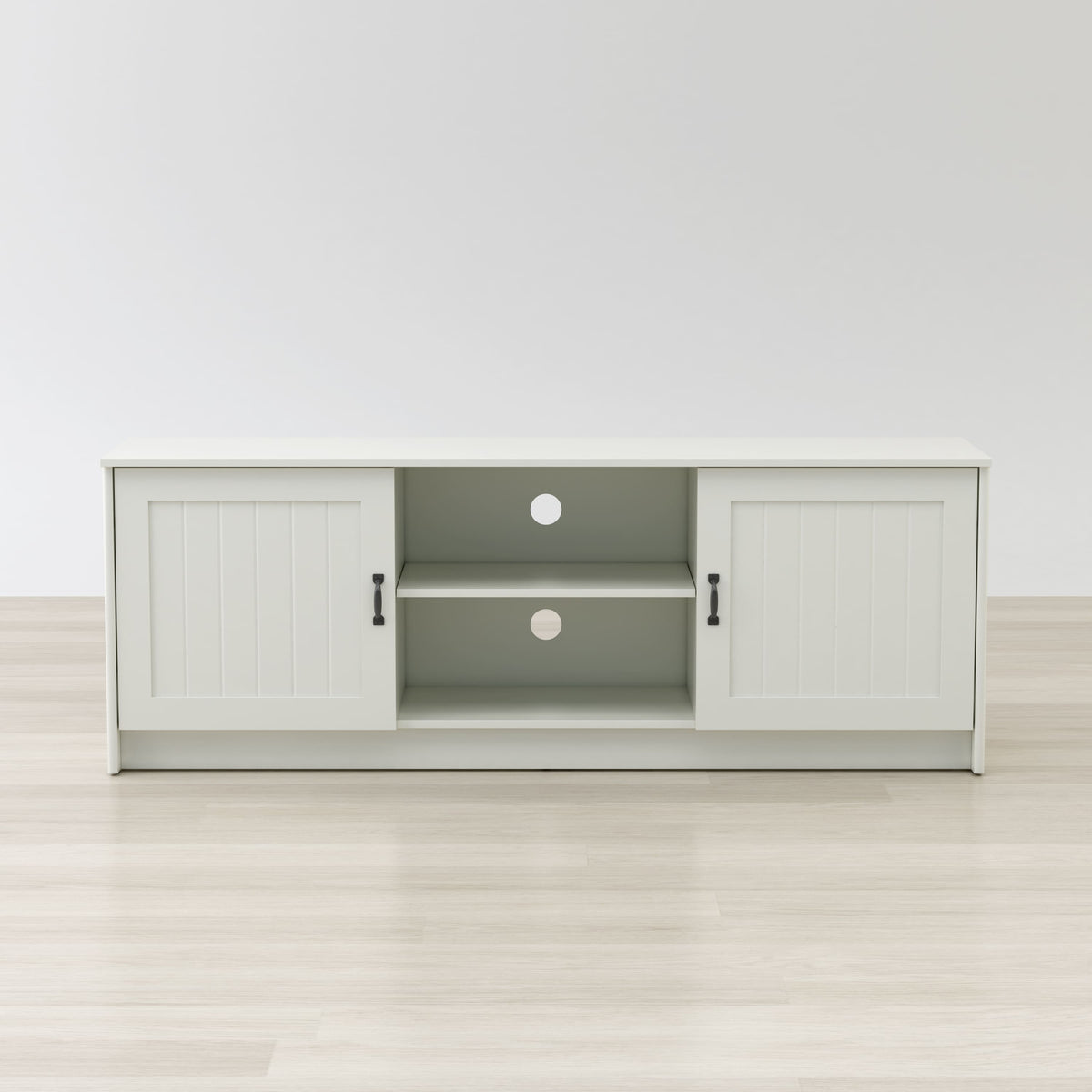 White entertainment console with open doors on a white background