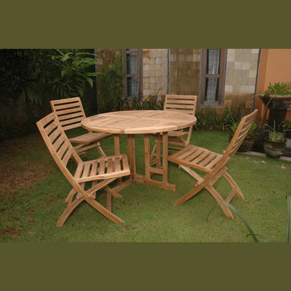 Wooden outdoor table with four matching chairs on a grassy area.