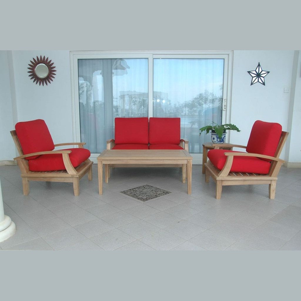 Outdoor furniture set with red cushions and a wooden table on a patio.