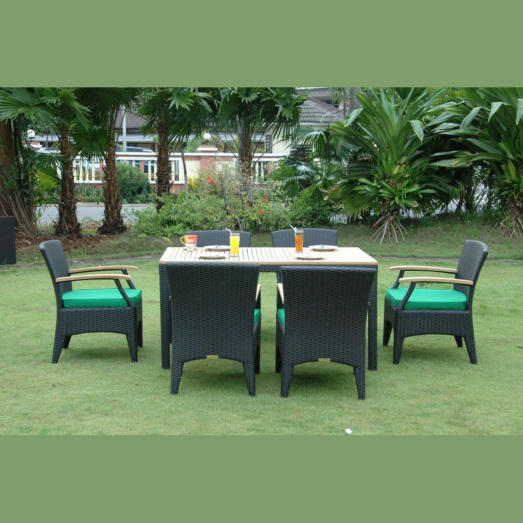 Black outdoor furniture set on a grassy area with greenery in the background