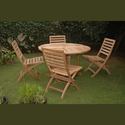 Wooden outdoor dining set with round table and four chairs on a grassy area.